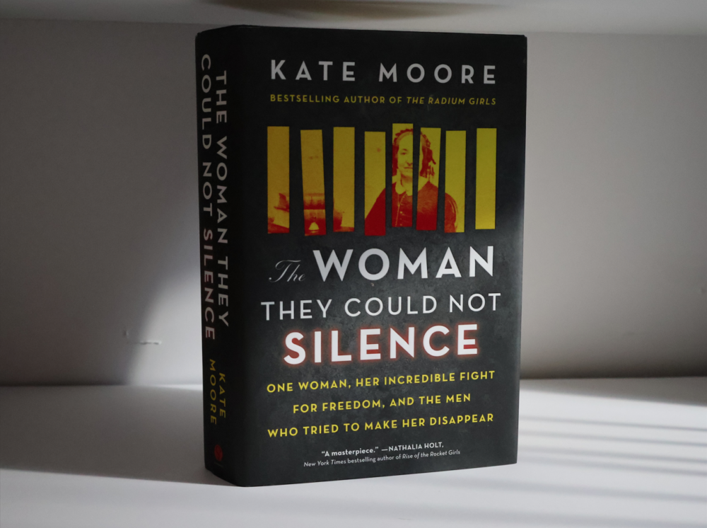 The Woman They Could Not Silence book, standing in shadow of bars.